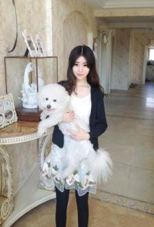 The girl hugging a dog
