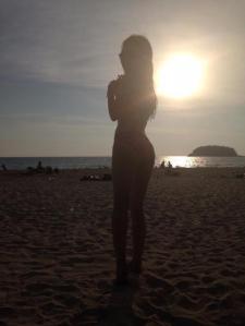 Sunset bikini girl on the beach