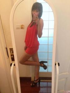 Feel confident in front of mirror, red mini-skirt
